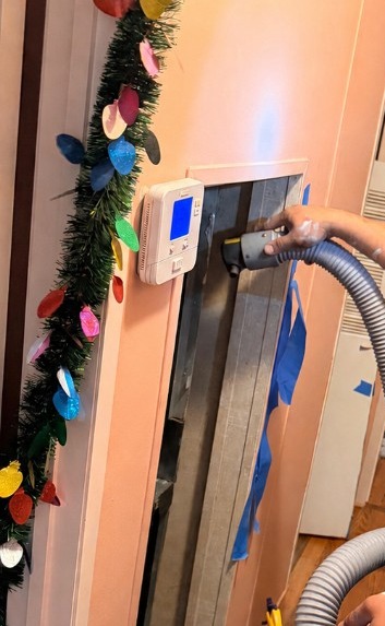 Disinfection hose guided into a hallway return opening